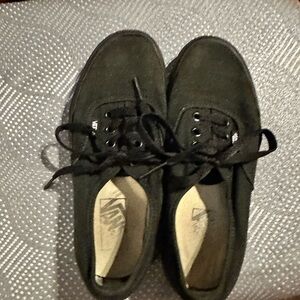 Used black on black Vans.